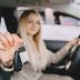 Lady in a car salon. Woman buying the car. Elegant woman in a brown suit.
